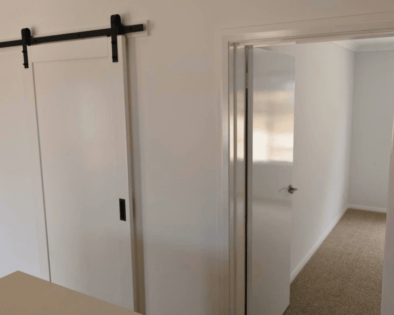 Barn doors to the study of a modular home in Gibson, WA by TR Homes